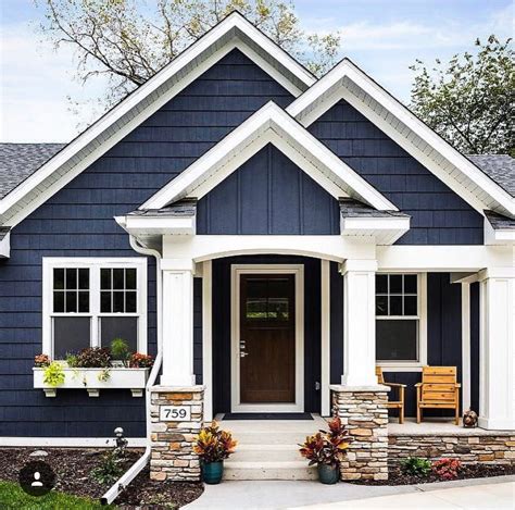 dark blue house with white trim and metal roof|dark blue house exterior colors.